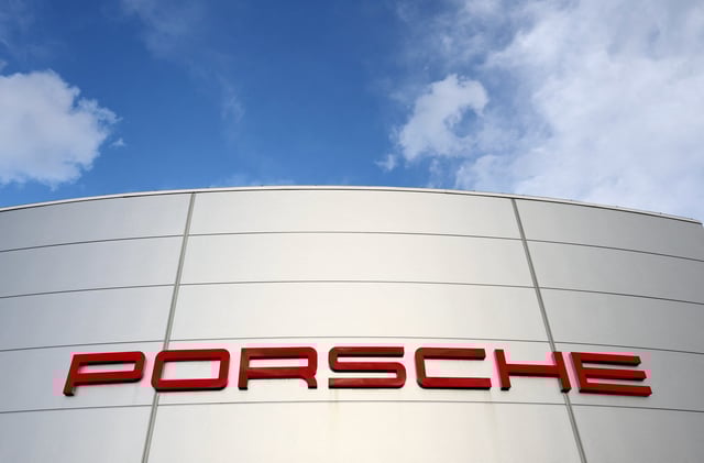 A logo of Porsche is seen outside a Porsche car dealer in Brussels, Belgium March 13, 2023. REUTERS/Yves Herman/File Photo