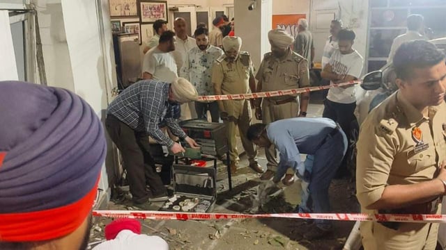 Police and forensic experts collecting evidence after the blast at the house of Manoranjan Kalia’s house in Jalandhar on Tuesday. (HT Photo)