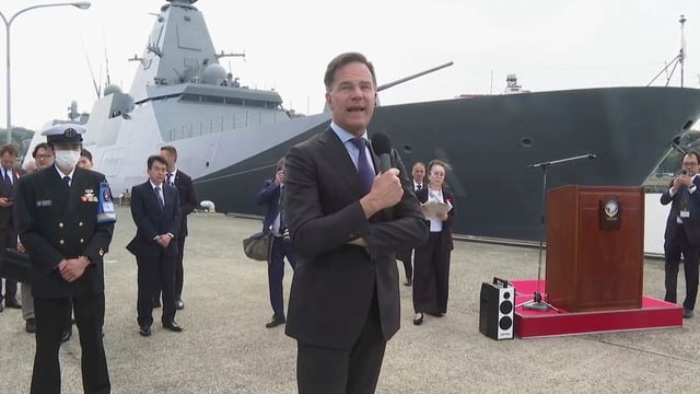 In this image made from video, NATO's Secretary General Mark Rutte speaks in front of Japan Maritime Self-Defense Force's frigate Mogami during his visit to Japan's Maritime Self-Defense Force base in Yokosuka, south of Tokyo Tuesday, April 8, 2025. (AP Photo)