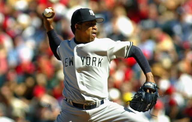 Pitcher Octavio Dotel #29 of the New York Yankees pitches against the Los Angeles Angels of Anaheim during the MLB game held on August 26, 2006 at Angel Stadium in Anaheim, California.