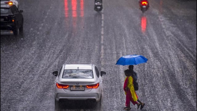 Citizens commute amid heavy rain in Pune. (PTI Photo)