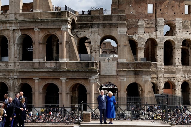 Britain's King Charles and Queen Camilla stand during a visit to the Colosseum in Rome, Italy, April 8, 2025. REUTERS/Remo Casilli