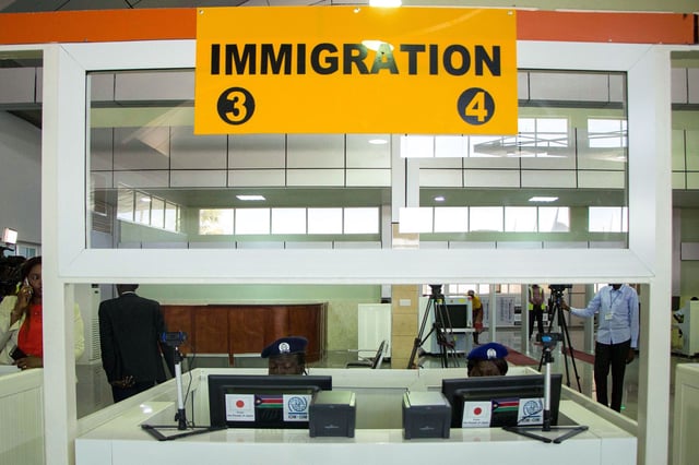 Immigration officers are sitting in front of computers at the new terminal building of Juba International Airport in Juba, South Sudan, on October 29, 2018.