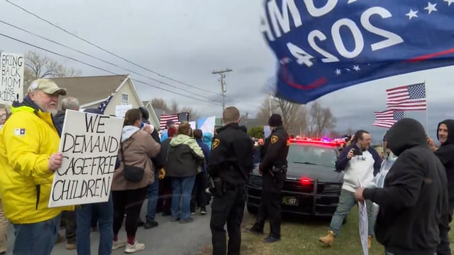 Protesters and counterprotesters demonstrate over the detention of a mother and her three children by immigration enforcement officials in Sackets Harbor, New York, on Saturday.
