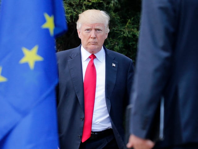 US President Donald Trump arrives to pose for a family photo with participants of the G7 summit during the Summit of the Heads of State and of Government of the G7, the group of most industrialized economies, plus the European Union, on May 27, 2017 in Taormina, Sicily. The leaders of Britain, Canada, France, Germany, Japan, the US and Italy will be joined by representatives of the European Union and the International Monetary Fund (IMF) as well as teams from Ethiopia, Kenya, Niger, Nigeria and Tunisia during the summit from May 26 to 27, 2017. (Photo by JONATHAN ERNST / POOL / AFP) (Photo by JONATHAN ERNST/POOL/AFP via Getty Images)