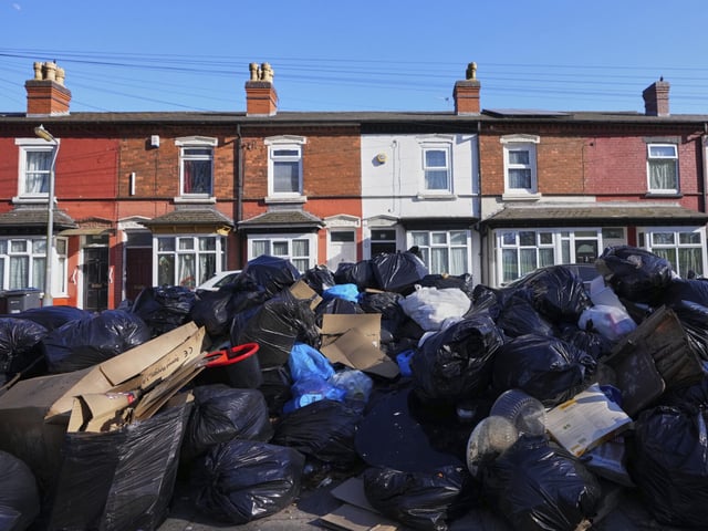 Rubbish piles up on a residential street in Birmingham, England, Monday, April 7, 2025, amid an ongoing refuse workers' strike in the city. (AP Photo/Kirsty Wigglesworth)