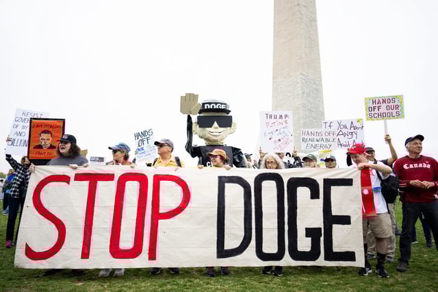 Thousands of protesters gather for the Hands Off rally around the Washington Monument on Saturday.