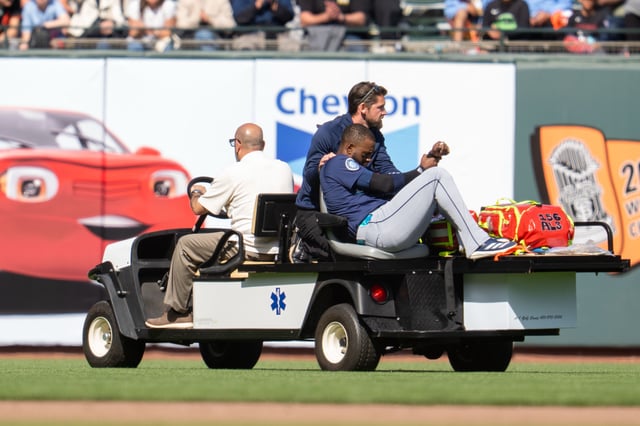 Apr 6, 2025; San Francisco, California, USA; Seattle Mariners right fielder Victor Robles (10) hurt during the play against the San Francisco Giants during the ninth inning attended medical personal at Oracle Park. Mandatory Credit: Neville E. Guard-Imagn Images/File Photo