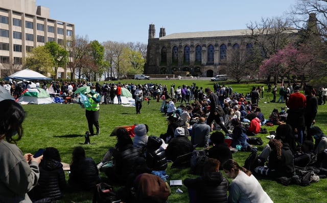 Demonstrators gather at an encampment where students are protesting in support of Palestinians, during the ongoing conflict between Israel and the Palestinian Islamist group Hamas, at Northwestern University campus in Evanston, Illinois, U.S., April 25, 2024.   REUTERS/Nate Swanson
