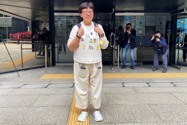Social worker Jackie Chen Hung-sau arrives at the district court ahead of the verdict in her rioting retrial, in Hong Kong, China March 11, 2025. REUTERS/Jessie Pang/File Photo