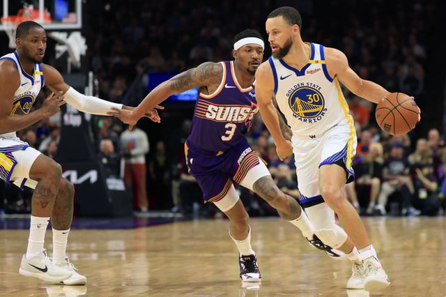 Apr 8, 2025; Phoenix, Arizona, USA; Golden State Warriors guard Stephen Curry (30) dribbles the ball against Phoenix Suns guard Bradley Beal (3) during the first half at Footprint Center. Mandatory Credit: Mark J. Rebilas-Imagn Images