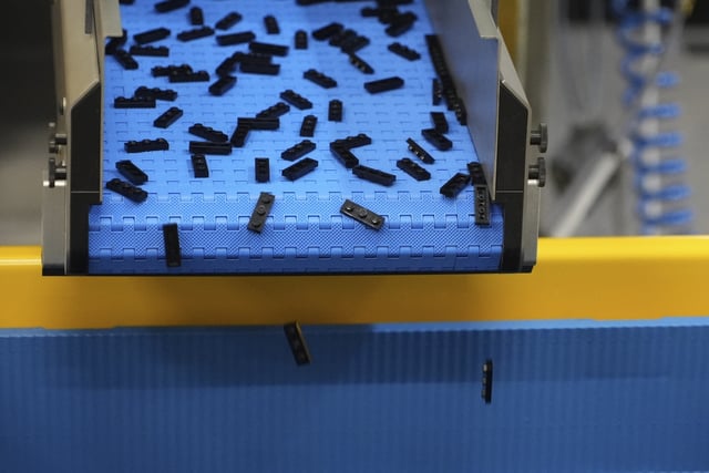 Lego bricks are moved on conveyor belt at Lego factory in Binh Duong, Vietnam Wednesday, April 2, 2025. (AP Photo/Hau Dinh)