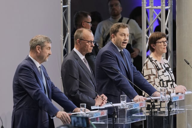 Markus Soeder, chairman of Bavarian¥s Christian Social Union party, Friedrich Merz, Christian Democratic Union party chairman and the Social Democratic Party co-leaders Lars Klingbeil and Saskia Esken, brief the media after reaching an agreement between their parties on a coalition for a new German government at a news conference in Berlin, Germany, Wednesday, April 9, 2025. (AP Photo/Markus Schreiber)