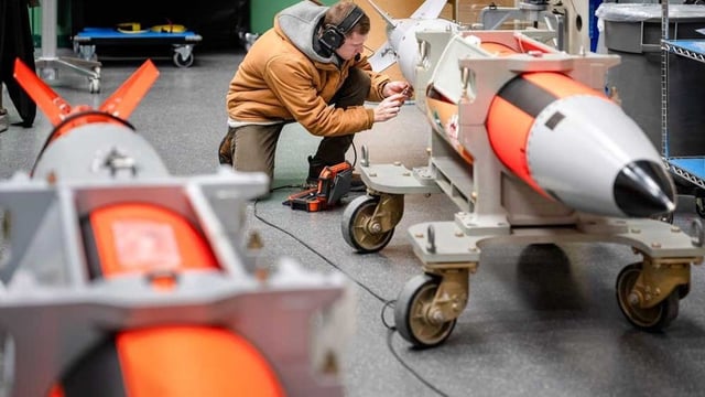 An engineer makes connections on the first B61-13 joint test assembly. Production of the B61-13 bomb is seven months ahead of schedule. (Photo/Sandia.gov)