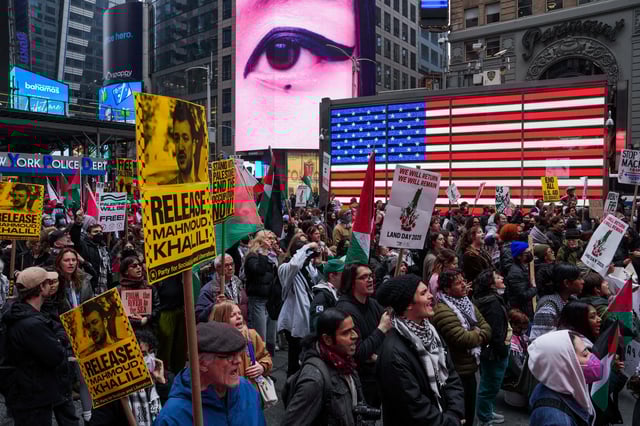People hold signs with images of Palestinian activist and Columbia University graduate student Mahmoud Khalil as they take part in a pro-Palestinian rally to commemorate Land Day in New York City, U.S., March 30, 2025. REUTERS/Adam Gray