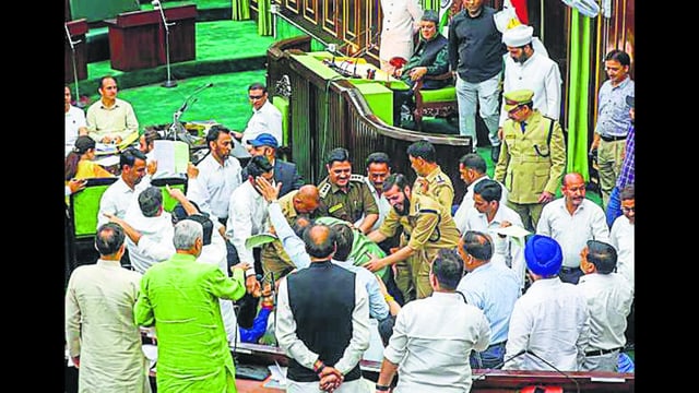 Legislators locked in scuffle inside the House during the budget session in Jammu on Wednesday. (PTI)