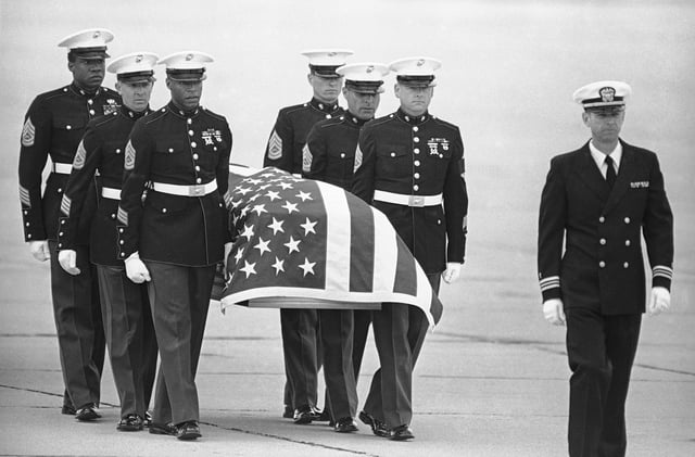 FILE - U.S. Marine Corps pallbearers carry the casket holding the body of slain U.S. Drug Enforcement agent Enrique Camarena after it arrived at North Island Naval Air Station, in San Diego, March 8, 1985. (AP Photo/Lenny Ignelzi, File)