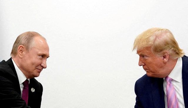 U.S. President Donald Trump and Russian President Vladimir Putin hold a bilateral meeting at the G20 leaders summit in Osaka, Japan, June 28, 2019.  REUTERS/Kevin Lamarque/File Photo/File Photo