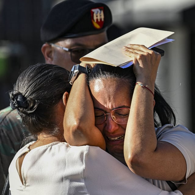 A woman cries outside of the Jet Set nightclub Wednesday.