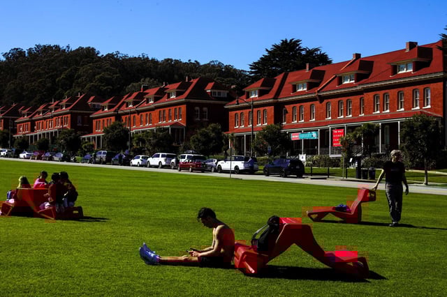 Visitors enjoy springlike weather in the quad outside the Montgomery Barracks in the Presidio in San Francisco on Feb. 20.