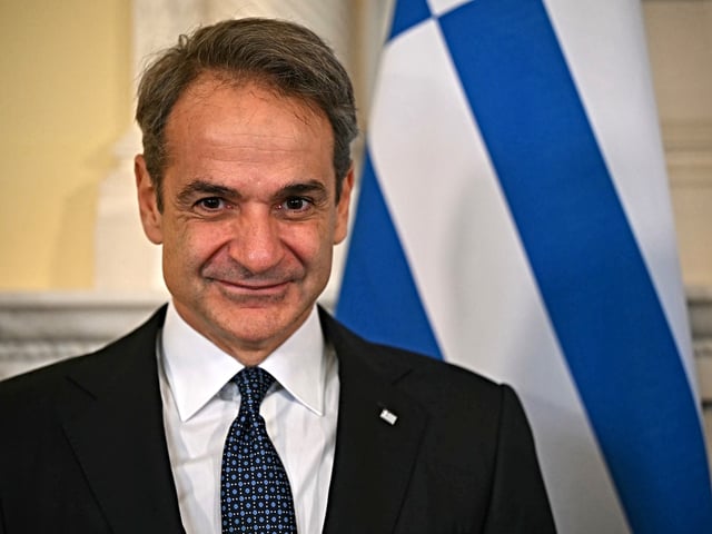 LONDON, ENGLAND - DECEMBER 3: Greece's Prime Minister Kyriakos Mitsotakis reacts as he poses for a photograph with Britain's Prime Minister Keir Starmer (unseen) ahead of their meeting inside of 10 Downing Street on December 3, 2024 in London, United Kingdom. The two leaders are expected to discuss a long-standing dispute over the Parthenon Sculptures, also known as the Elgin Marbles, which have been part of the British Museum collection since 1816. The sculptures were removed from the Parthenon by Lord Elgin in the early 19th century while he was serving as British ambassador to the Ottoman Empire, which at the time ruled Greece. Last year former British prime minister Rishi Sunak cancelled a meeting with Mr. Mitsotakis after the Greek prime minister pushed for the return of the marbles during an interview. (Photo by Justin Tallis - WPA Pool/Getty Images)