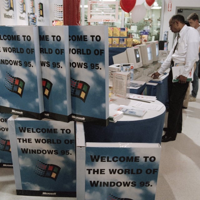 windows 95 boxes in front of computers