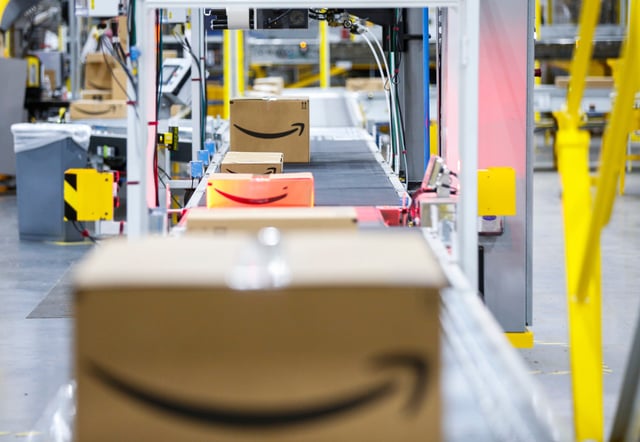 Packages make their way through the Amazon fulfillment center in Republic, Missouri on their way to be shipped out on Friday, Dec. 2, 2022.