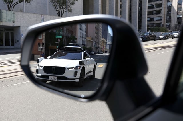 SAN FRANCISCO, CALIFORNIA – APRIL 11: A Waymo autonomous vehicle is seen reflected in a mirror as it drives along California Street on April 11, 2022 in San Francisco, California. San Francisco is serving as testing grounds for autonomous vehicles with Waymo, a Google subsidiary and Cruise, a subsidiary of General Motors, logging millions of test miles throughout San Francisco in 2021. (Photo by Justin Sullivan/Getty Images)