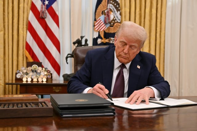 US President Donald Trump signs an executive order to declassify files on the assassinations of former president John F. Kennedy, former attorney general Robert F. Kennedy and civil rights leader Martin Luther King Jr