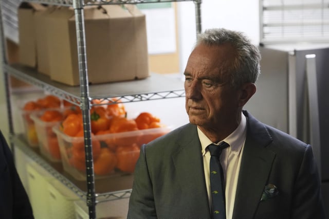 U.S. Health Secretary Robert F. Kennedy Jr. tours the Native Health Mesa Food Distribution Center in Mesa, Ariz., Tuesday, April 8, 2025. (AP Photo/Ross D. Franklin)