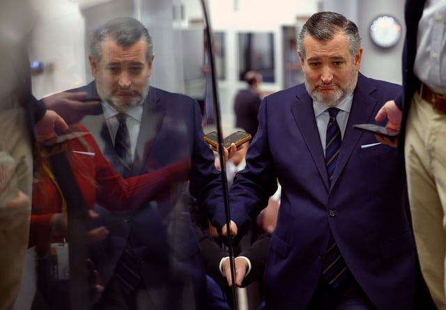 U.S. Sen. Ted Cruz (R-TX) talks to reporters as he rides an escalator at the U.S. Capitol on March 25, 2025 in Washington, DC.