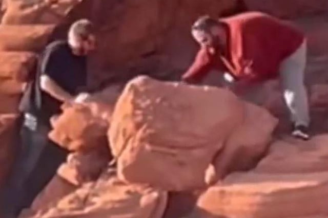 The National Park Service shared a screen capture of a video showing two men toppling ancient rock formations at Lake Mead National Recreation Area on April 7, 2024.