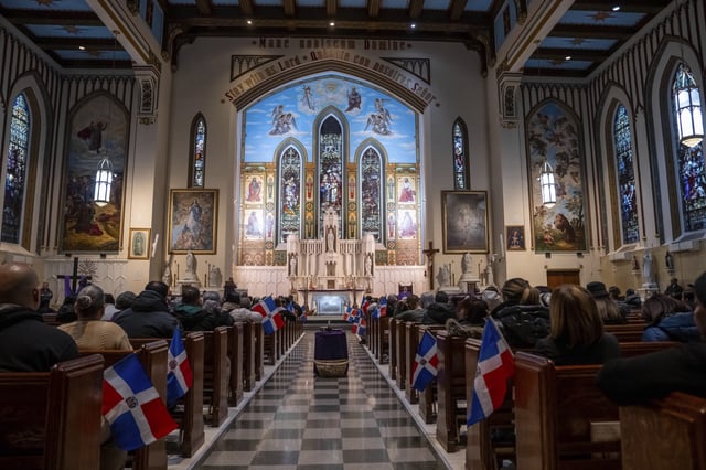 People attend a Mass for the victims of the Jet Set club roof collapse, at St. Elizabeth's Church, Wednesday, April 9, 2025 in New York. (AP Photo/Adam Gray)