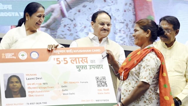Union Health Minister JP Nadda and Delhi Chief Minister Rekha Gupta hand out Ayushman Cards to beneficiaries on Thursday. (Sanjeev Verma/HT PHOTO)