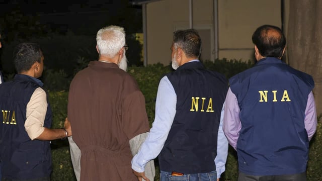 Mumbai terror attack accused Tahawwur Hussain Rana with NIA officials upon his arrival at the IGI Airport, in New Delhi. 