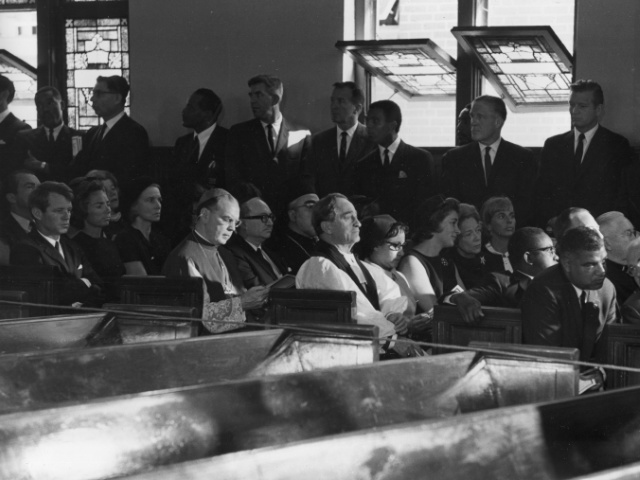 Mourners gather at the Ebenezer Baptist Church for funeral services for the late Dr. Martin Luther King Jr., in Atlanta, Ga., April 9, 1968. Seated from far left are, Sen. Robert Kennedy and his wife, Ethel; Archbishop Cooke of New York, in front of Kennedy; Margaretta Rockefeller, third from left in next row; Whitney Young of the Urban League, leaning forward and speaking to Atlanta Mayor Ivan Allen, at far right. Among the people standing are, Michigan Gov. George Romney, third from right; New York Mayor John Lindsay; and New York Gov. Nelson Rockefeller, far right. (AP Photo)