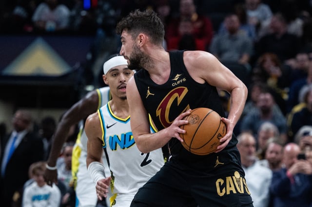 Apr 10, 2025; Indianapolis, Indiana, USA; Cleveland Cavaliers guard Ty Jerome (2) holds the ball while Indiana Pacers guard Andrew Nembhard (2) defends in the second half at Gainbridge Fieldhouse. Mandatory Credit: Trevor Ruszkowski-Imagn Images
