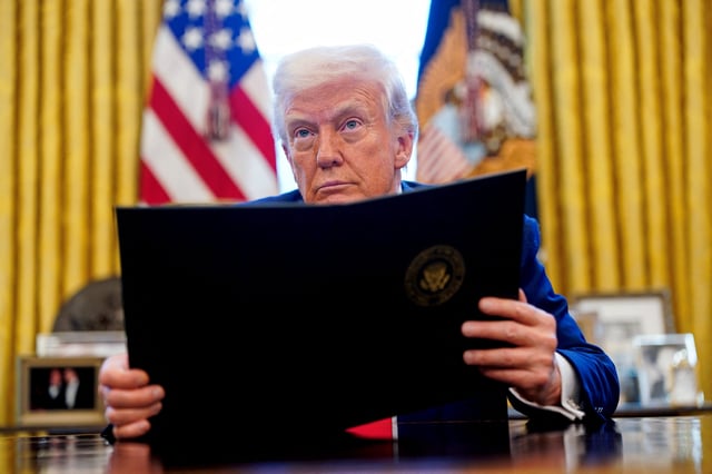 President Donald Trump signs executive orders and proclamations in the Oval Office at the White House on April 9, 2025.