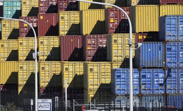 Shipping containers are stacked at Port Botany in Sydney, Australia, Monday, April 7, 2025. (AP Photo/Rick Rycroft)