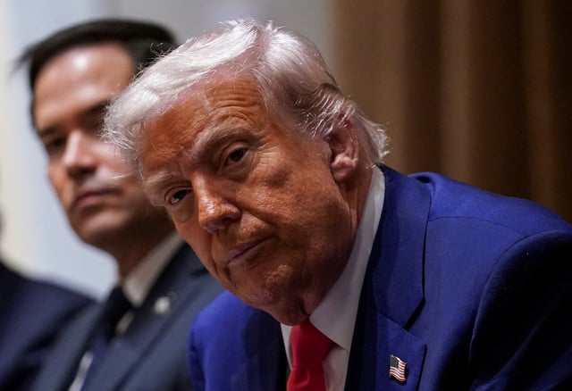 U.S. President Donald Trump attends a cabinet meeting at the White House in Washington, D.C., U.S., April 10, 2025. REUTERS/Nathan Howard/File Photo
