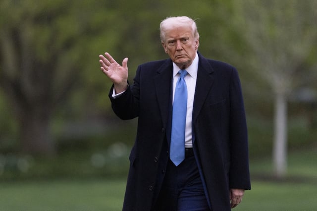 President Donald Trump waves as he walks on the South Lawn upon arrival at the White House on Marine One, Sunday, April 6, 2025, in Washington.