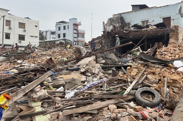 People clean debris from damaged buildings in the aftermath of an earthquake on March 28, in Naypyitaw, Myanmar, Monday, April 7, 2025. (AP Photo)