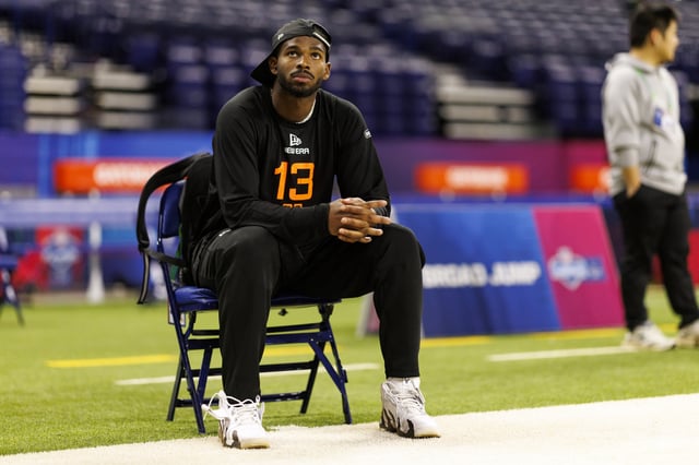 Shedeur Sanders #QB13 of Colorado sits on the field during the NFL Scouting Combine at Lucas Oil Stadium on March 1, 2025.
