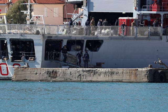 The Italian navy ship Libra, carrying migrants as part of a deal with Italy to process asylum-seekers caught near Italian waters, arrives in Shengjin, Albania, April 11, 2025. REUTERS/Florion Goga