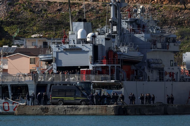 The Italian navy ship Libra, carrying migrants as part of a deal with Italy to process asylum-seekers caught near Italian waters, arrives in Shengjin, Albania, April 11, 2025. REUTERS/Florion Goga