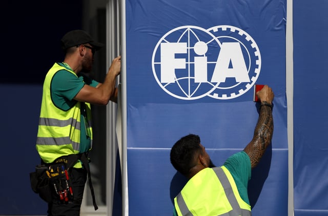 Formula One F1 - Abu Dhabi Grand Prix - Yas Marina Circuit, Abu Dhabi, United Arab Emirates - December 5, 2024 Workers prepare FIA branding in the paddock ahead of the grand prix REUTERS/Hamad I Mohammed
