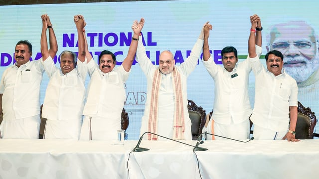 Union Home Minister Amit Shah joins hands with Bharatiya Janata Party (BJP) leader K Annamalai, All India Anna Dravida Munnetra Kazhagam (AIADMK) General Secretary Edappadi K. Palaniswami and others during a press conference, in Chennai on Friday.