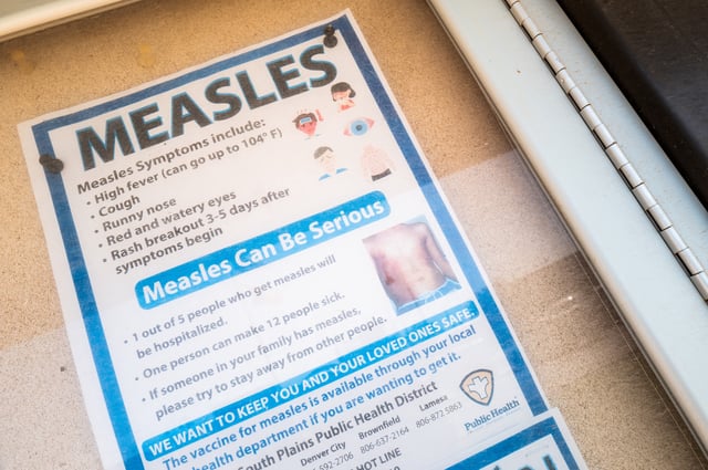 A measles advisory is shown tacked to a bulletin board outside Gaines County Courthouse on April 09, 2025 in Seminole, Texas. A second confirmed measles-related death has been reported in the city of Lubbock amidst an ongoing outbreak which began in late January. As of early April, the Texas Department of State Health Services has confirmed more than 500 cases within 22 counties, ranging from the South Plains toward the Panhandle.