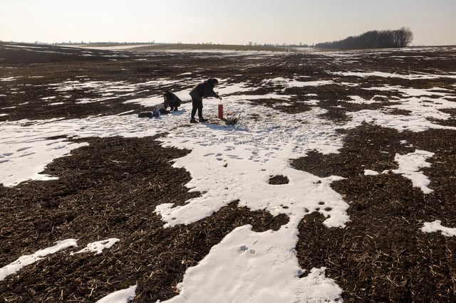 Environmental experts of CDM Engineering Ukraine,Yuliia Zazerina and Alina Tatarchuk, test the groundwater level at the Polokhivske lithium deposit that will be developed by Ukrlithium Mining in the Malovyskivsky district of Ukraine’s Kirovograd region, amid Russia's attack on Ukraine, February 27, 2025.  REUTERS/Thomas Peter/File Photo