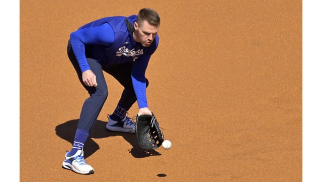Dodgers first baseman Freddie Freeman warms up before a game against the Chicago Cubs on Friday at Dodger Stadium. Freeman acknowledged that sitting out for nine games was the right decision after aggravating his surgically repaired right ankle. (AP Photo/Jayne Kamin-Oncea)